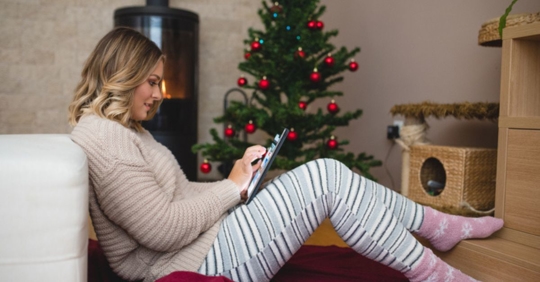 woman using tablet during the holidays